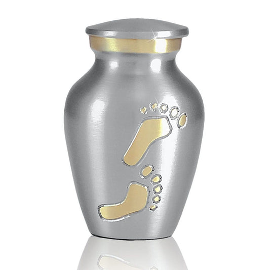 Small brass keepsake urn under three inches tall with a plain polished gold body