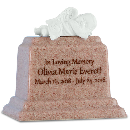 Small pale marble infant urn with natural veining and a smooth rounded body