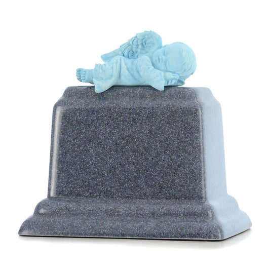 Small marble infant urn with pale veined stone and a softly rounded lid