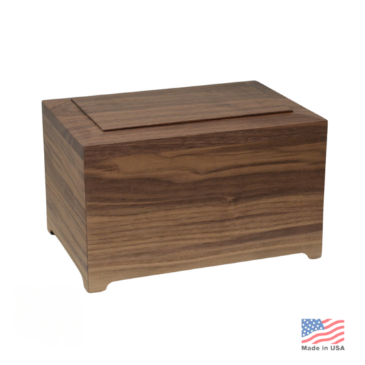 Low rectangular walnut cremation urn with dark grain, squared corners and flush lid