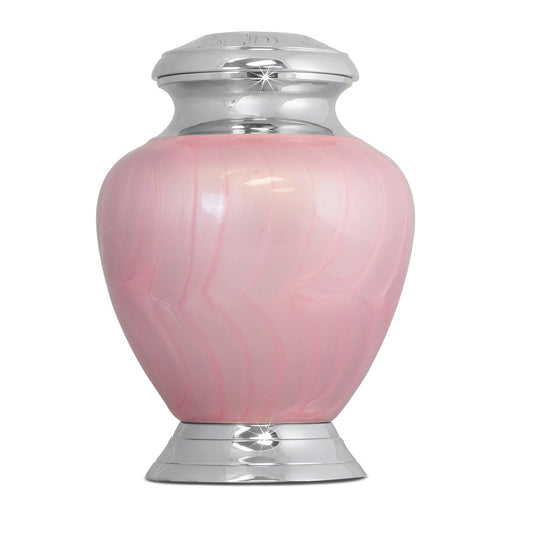 Small brass infant urn finished in soft pink with a rounded lid and squared base