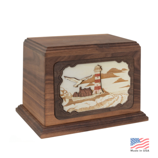 Wood cremation urn with a lighthouse sculpted in raised relief on the front panel