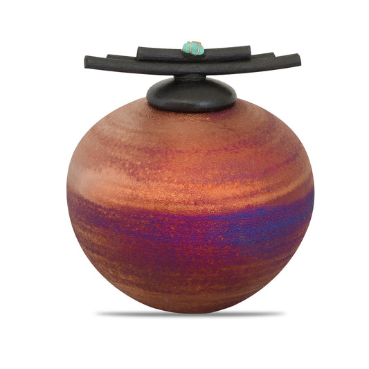 Small raku ceramic keepsake urn in earth-toned crackled glaze, three inches across