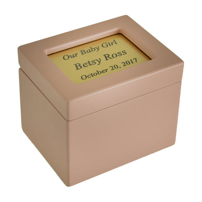 Small metal infant urn with a lift-off top lid and a plain rounded body