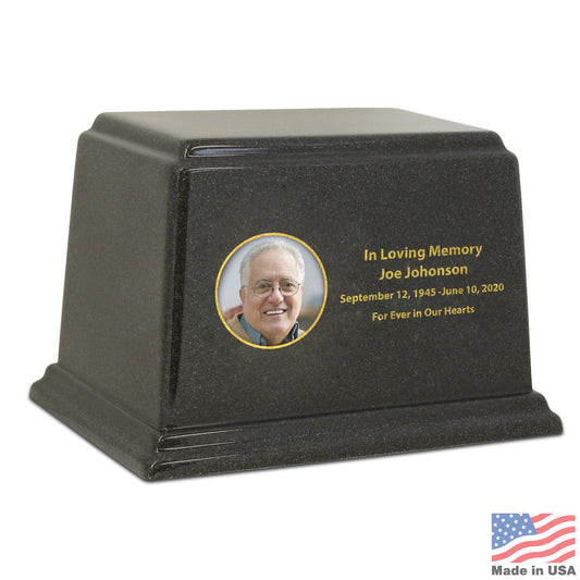 Black stone cremation urn with a wide rectangular body and a smooth polished finish