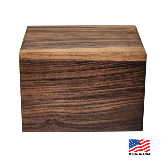Walnut companion cremation urn with dark close grain, twelve inches long, flat lid