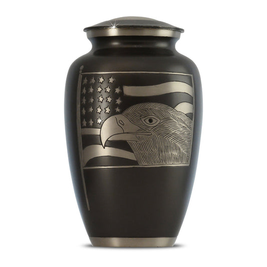 Brass cremation urn with a bald eagle and American flag motif on the front