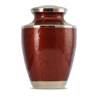 Brass cremation urn in a deep red finish with a plain undecorated body