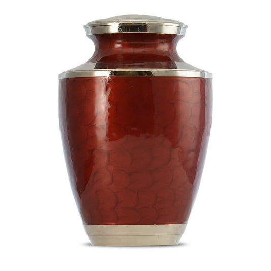 Brass cremation urn in a deep red finish with a plain undecorated body