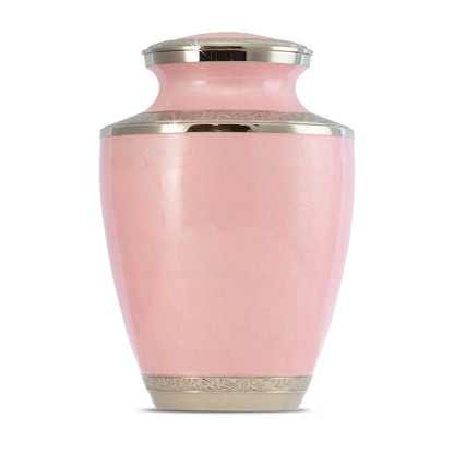 Pink brass cremation urn with painted floral band around the middle and gold trim