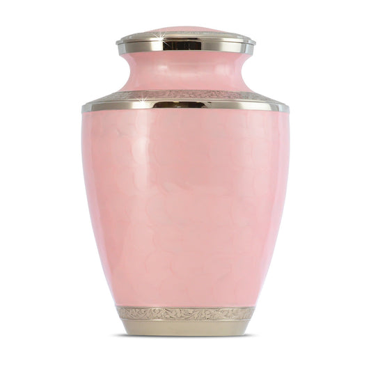 Pink brass cremation urn with painted floral band around the middle and gold trim