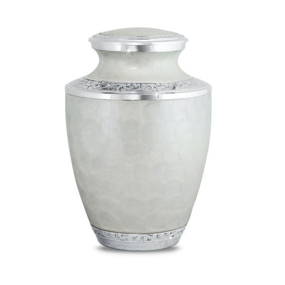 White brass cremation urn painted with a floral pattern around the body