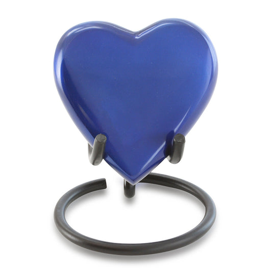 Slim brass keepsake urn with a blue enamel heart set at the top of a polished body