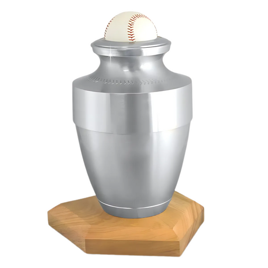 Brass cremation urn shaped as a baseball with raised curved stitching on the body