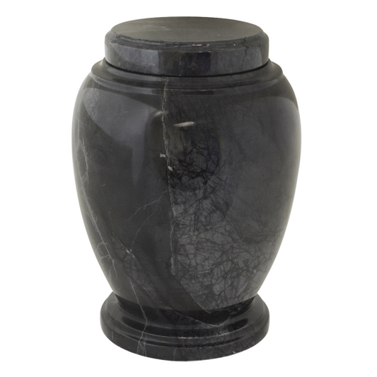 Contemporary black stone cremation urn with clean lines and an unmarked surface