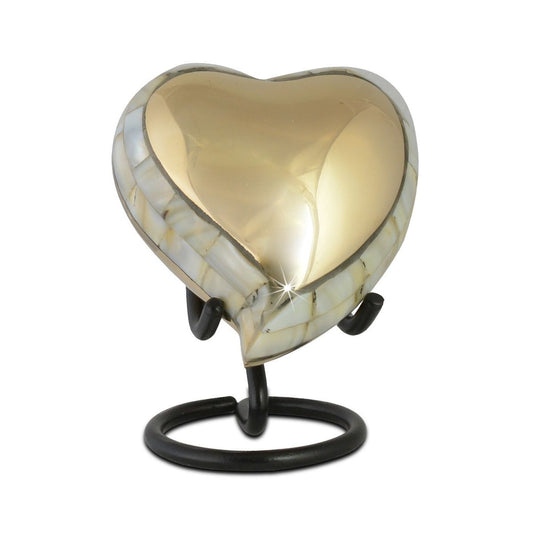Polished gold-tone brass keepsake urn with a plain rounded body and deep profile