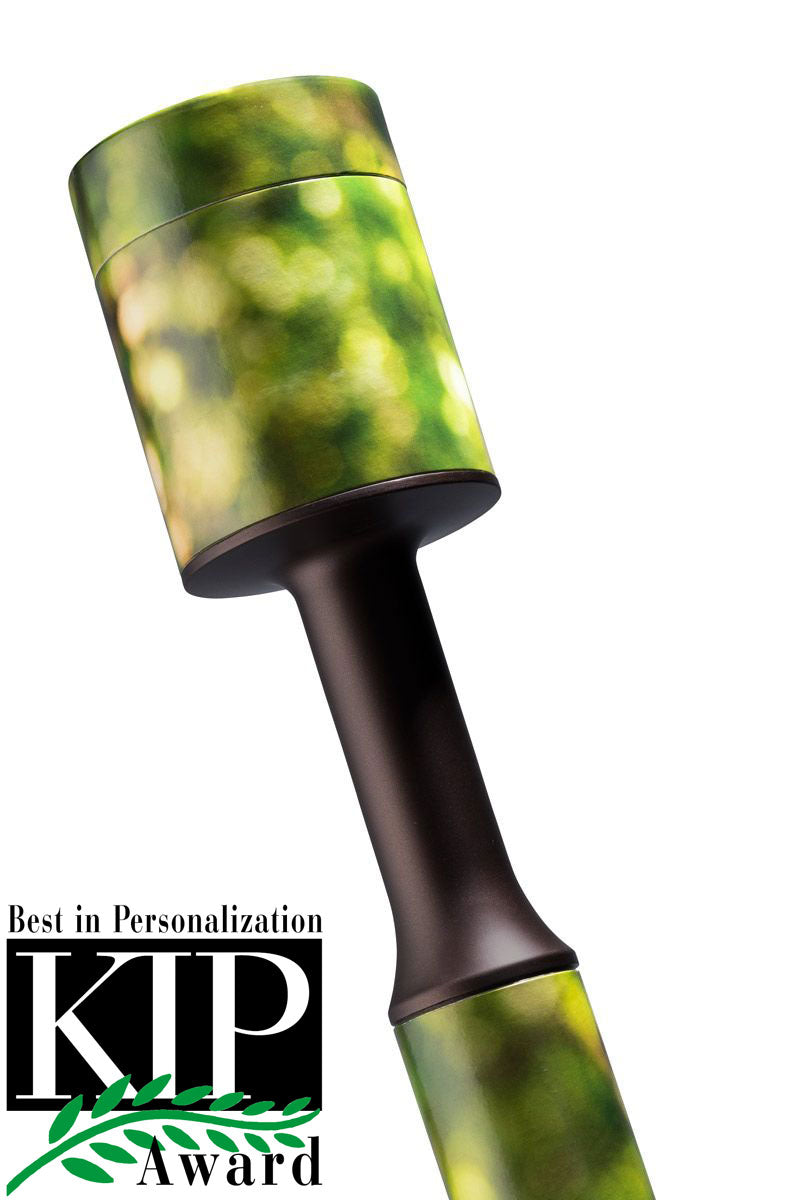 Green biodegradable cremation urn made of moulded cardboard with a lift-off top
