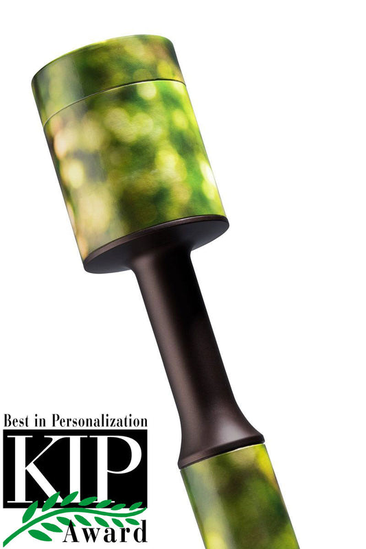 Green biodegradable cremation urn made of moulded cardboard with a lift-off top
