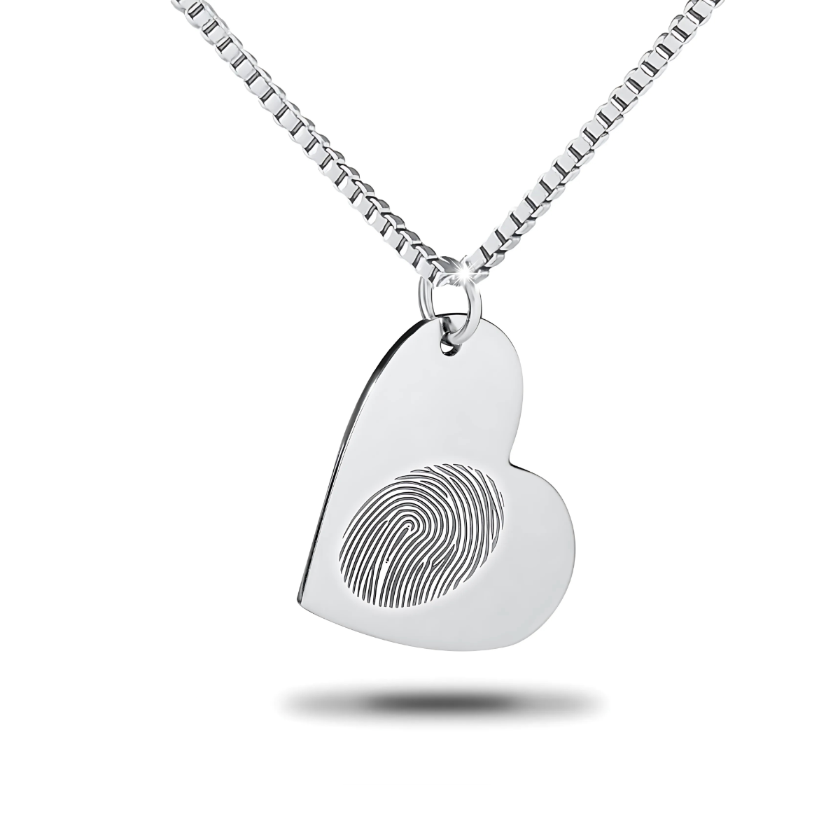 Flat silver heart pendant with a smooth blank surface hanging on a chain