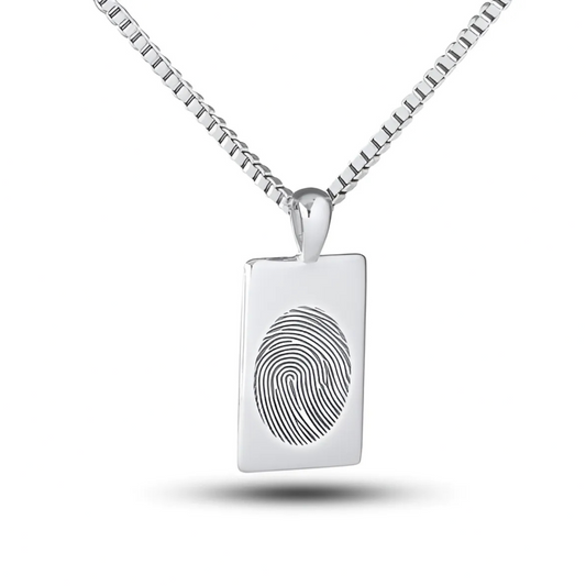 Silver dog tag shaped pendant with rounded corners and a blank face on a chain