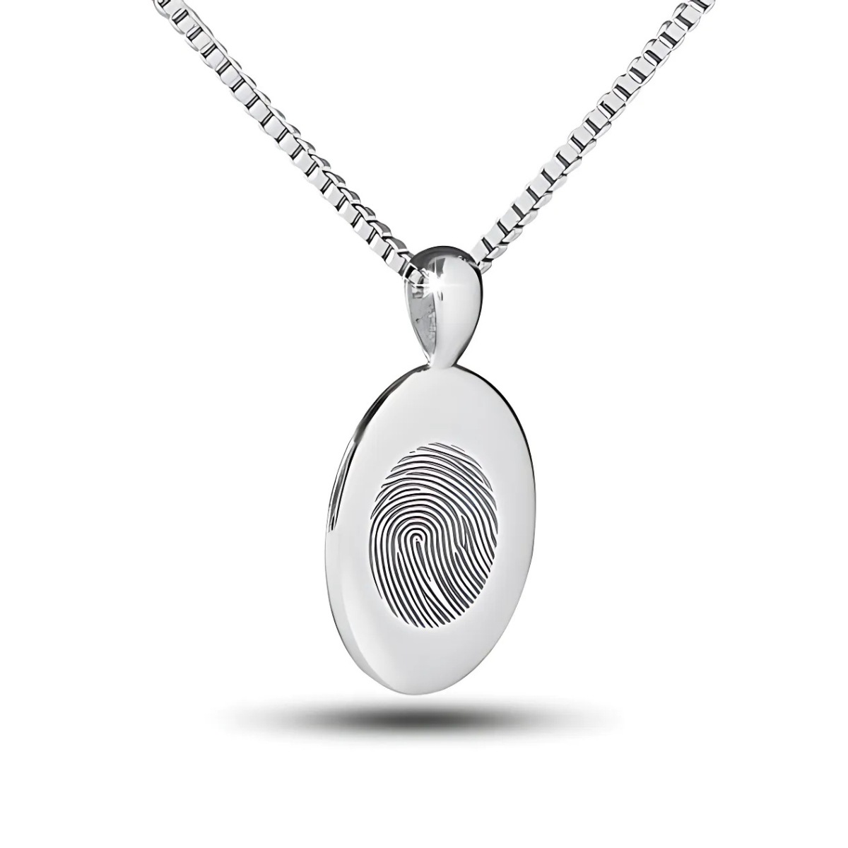 Flat silver oval pendant with an unengraved polished face hanging on a chain