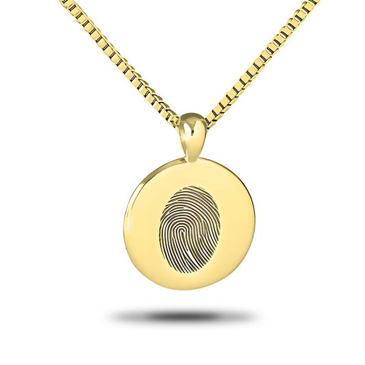 Round gold-finished steel pendant with an open ring profile hanging on a fine chain
