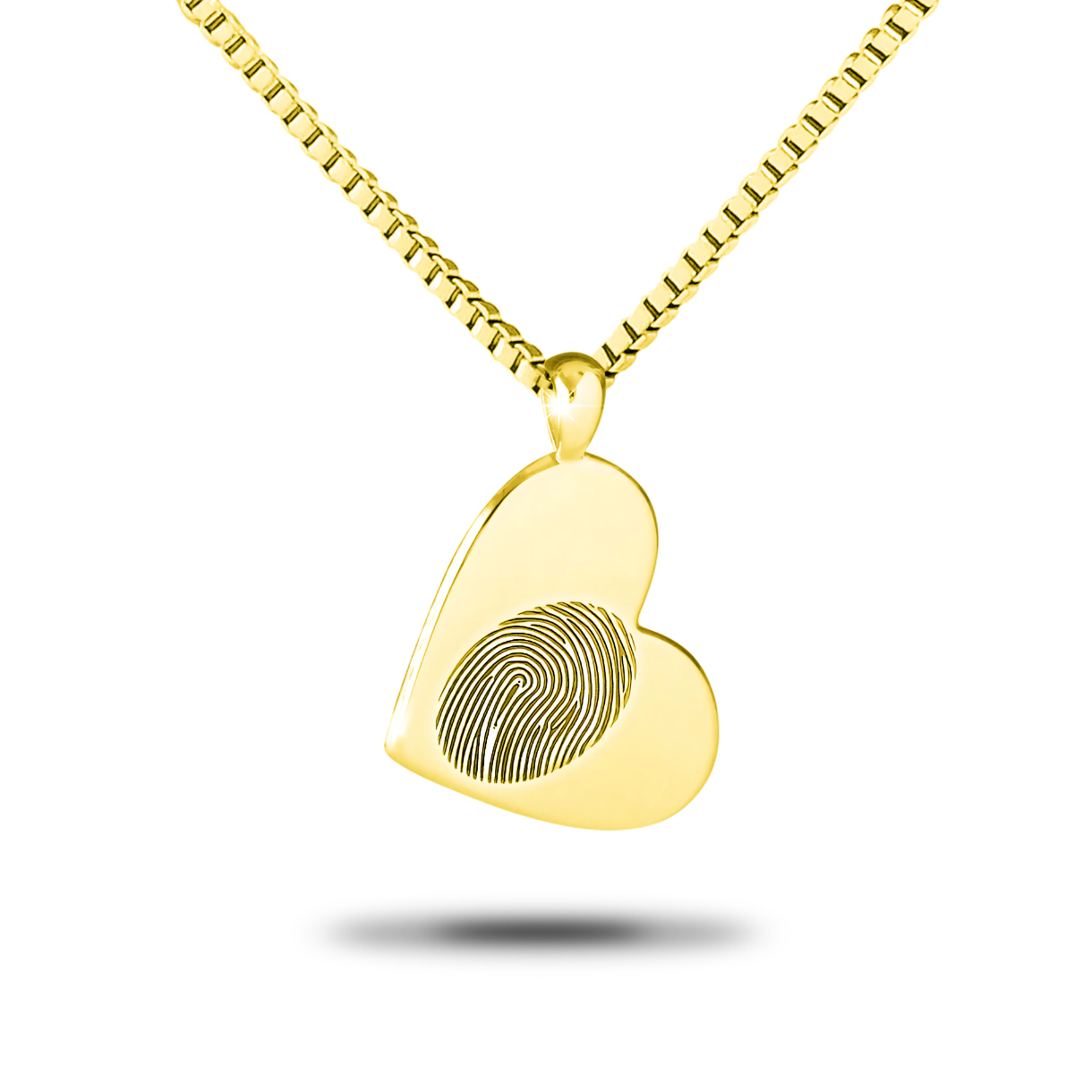 Solid gold heart pendant with a softly domed face hanging from a chain