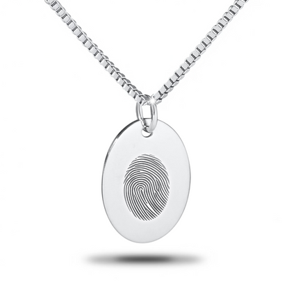 Large flat silver oval pendant with a smooth blank face on a chain