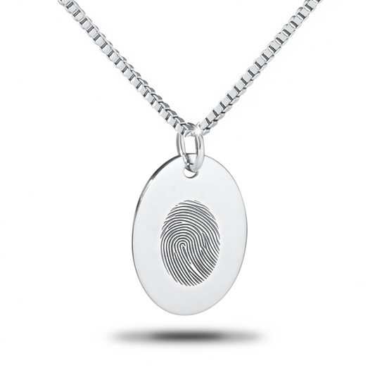 Large flat silver oval pendant with a smooth blank face on a chain