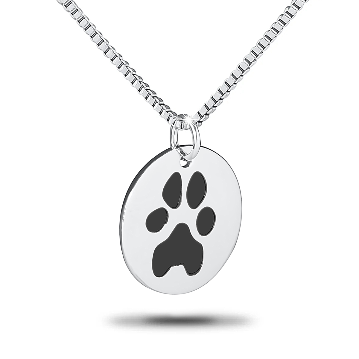 Round stainless steel pendant with an engraved paw print in the center