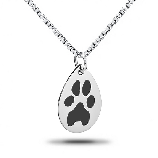 Teardrop-shaped steel pendant with an engraved paw print and a chain loop at the top
