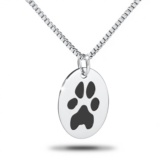 Oval stainless steel pendant engraved with a dog paw print, hung on a chain