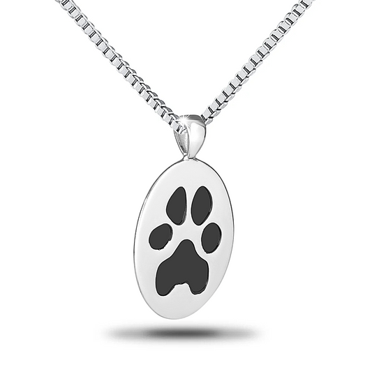 Vertical oval steel pendant engraved with a paw print and worn on a fine chain