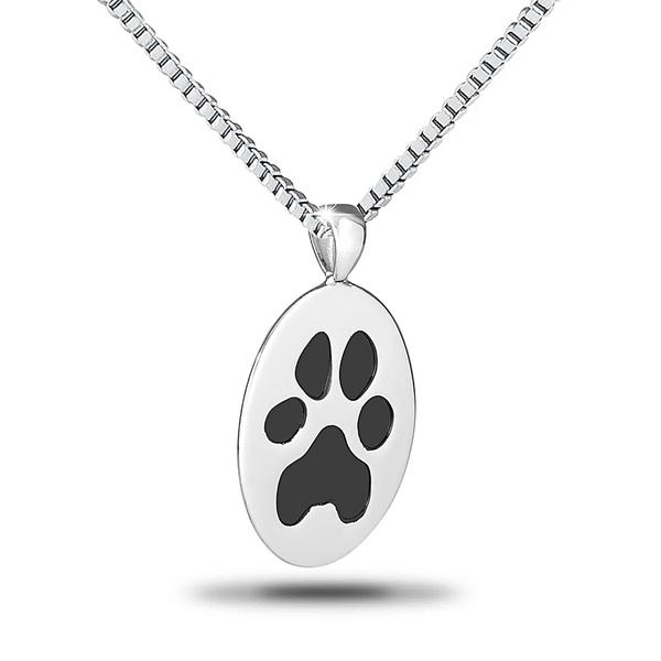 Vertical oval steel pendant engraved with a paw print and worn on a fine chain