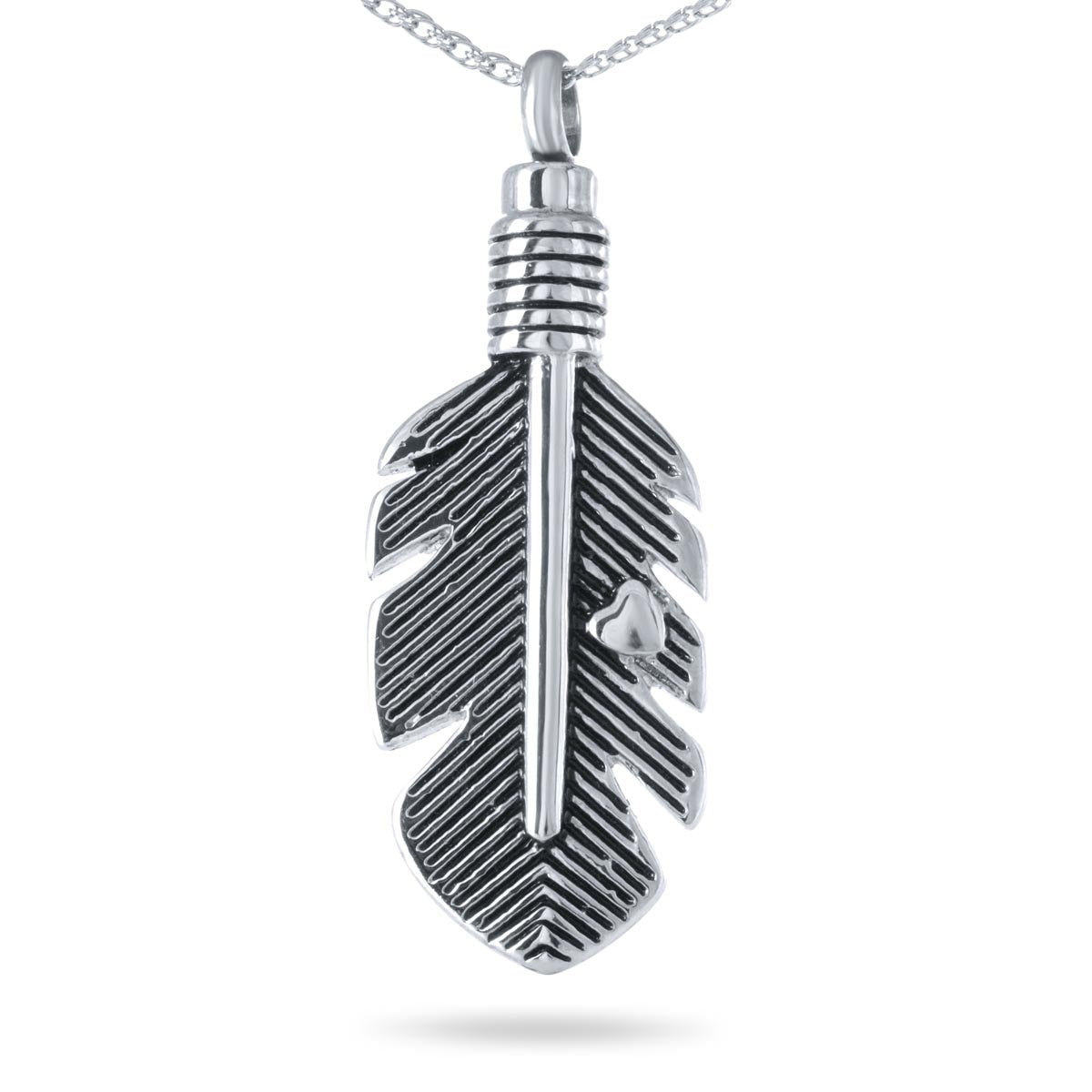 Wide stainless steel feather pendant lying almost horizontal with barbs cut into the metal