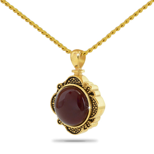 Gold-plated steel keepsake urn with a round red stone set into the front