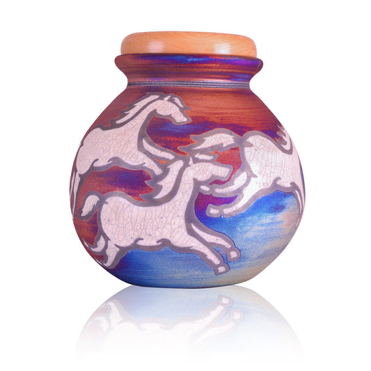 Ceramic Raku urn with running horses across a copper and midnight blue crackled glaze