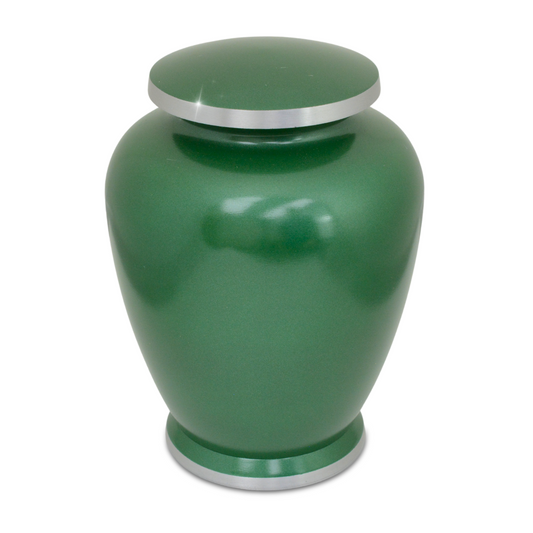 Tall aluminum cremation urn with a forest tree pattern worked around the body