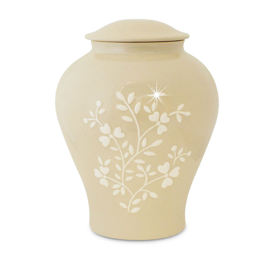 Ceramic cremation urn painted with spring flowers around the body, twelve inches tall