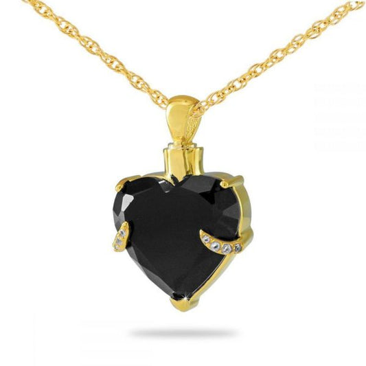 Gold-toned steel heart pendant with faceted black crystal glass across the face