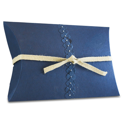 Long shallow water burial urn in pearl blue with a smooth pressed paper surface