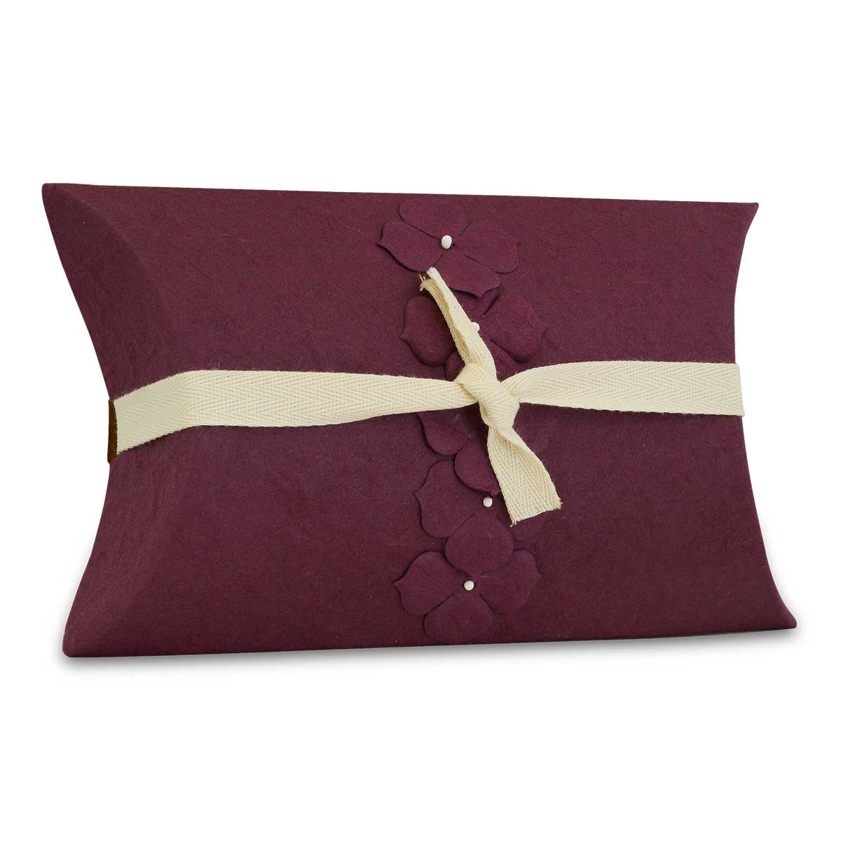 Small pearl purple biodegradable paper urn about six inches across and two deep