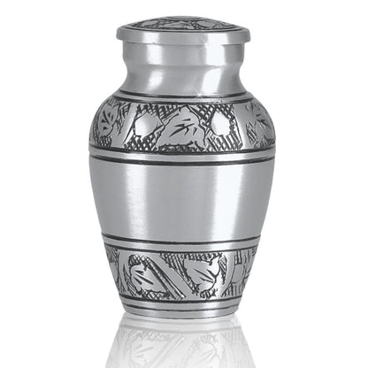 Pewter-finish keepsake urn with a raised vine pattern banding the middle