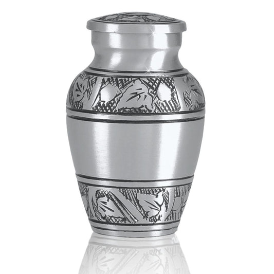 Pewter-finish keepsake urn with a raised vine pattern banding the middle