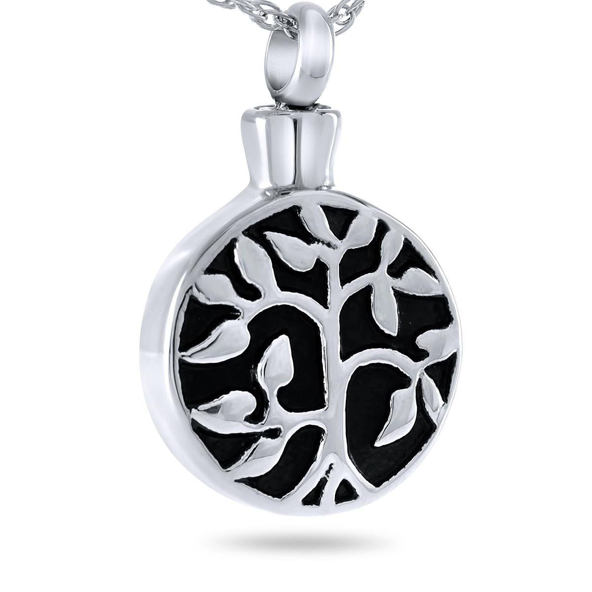 Small round steel pendant with a raised family tree design across the polished face