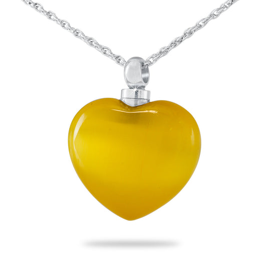 Gold-toned artisan glass heart pendant on a chain with a small threaded opening at the top