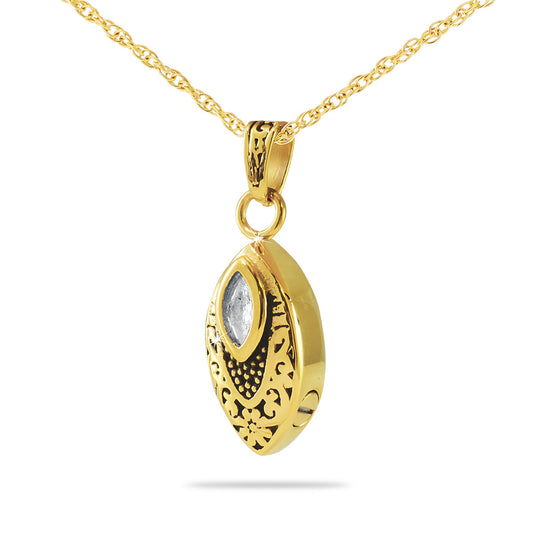 Gold cremation pendant set with a round clear crystal at the center of a polished charm