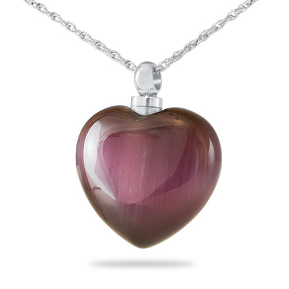 Purple blown glass heart pendant with swirled color, hanging from a fine chain