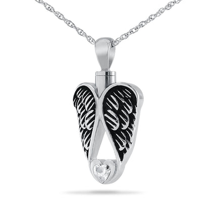 Silver heart pendant framed by two detailed feathered wings, on a silver chain