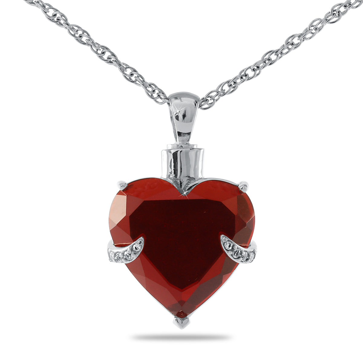 Small silver keepsake pendant, wider than it is tall, with a screw-top bail